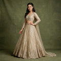 Embroidered gold lehenga with long-sleeve stitched blouse and flared skirt