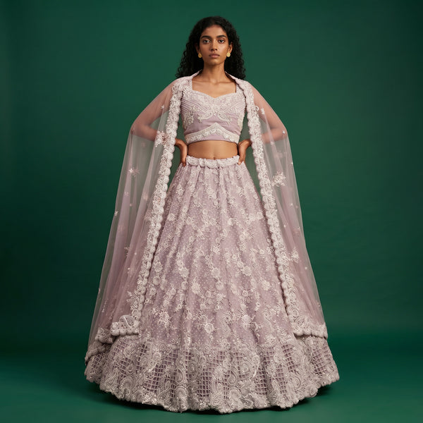 Lavender lehenga set with ornate blouse and matching skirt, heavy beadwork trim