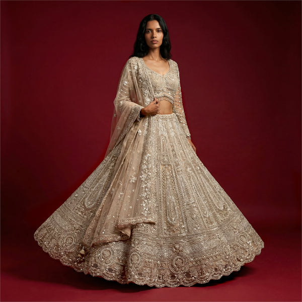 Ivory embellished lehenga with beaded embroidery, flared skirt and matching dupatta