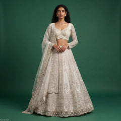 Pearl white embroidered lehenga with cropped blouse and sheer dupatta