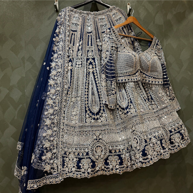 Embellished lehenga skirt with matching silver-toned embroidery and navy dupatta