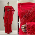 Red net saree with heavy sequin beadwork border and draped pallu detail