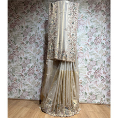Champagne viscose-silk saree with ornate gold border and cut-dana thread work