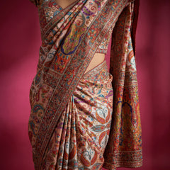 Ivory multicolour printed crepe saree with embroidered border and drape, close-up view