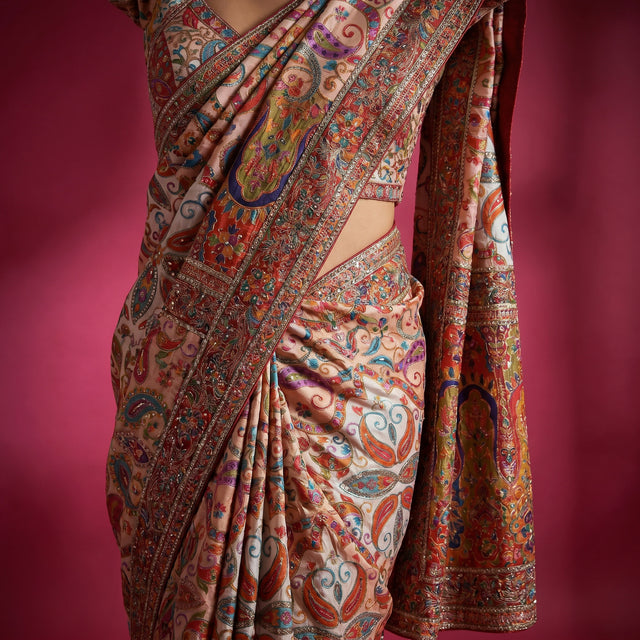 Ivory multicolour printed crepe saree with embroidered border and drape, close-up view
