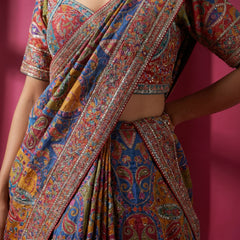 Multicolour paisley printed saree with embroidered trim and pleated drape detail