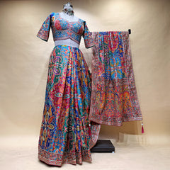 Multicolour printed teal blue viscose crepe saree with embroidered border and blouse