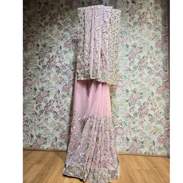 Blush pink georgette saree with gold resham and sequin vertical motifs, ornate border