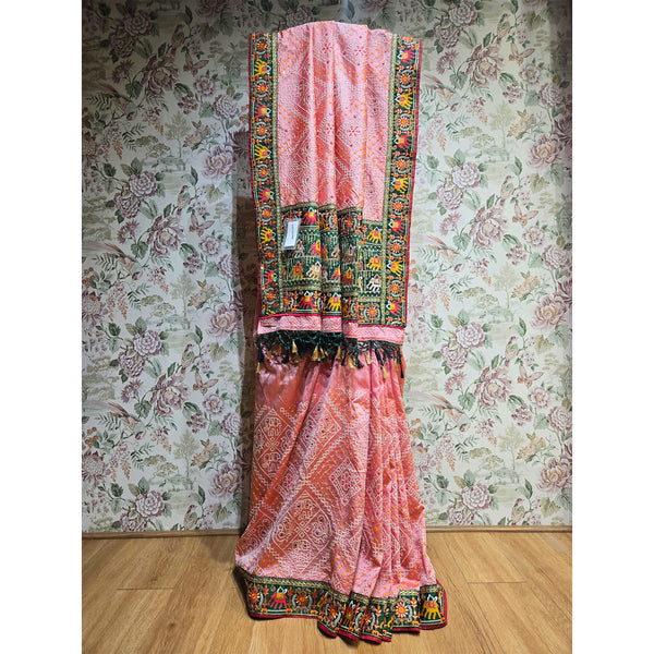 Rose pink silk saree with bandhani pattern, multicolor resham border and green folk trim