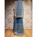Teal georgette saree with silver floral stone work and lace border