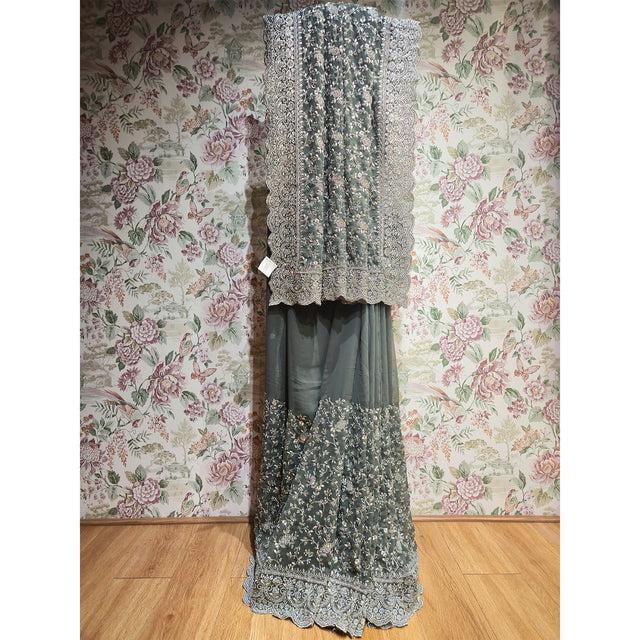 Grey georgette saree with silver stone floral border and fringe trim