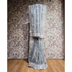 Silver grey organza saree with cut-dana & sequin work, decorative hem border