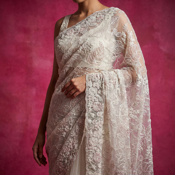 Ivory net saree with tonal thread embroidery on draped pallu
