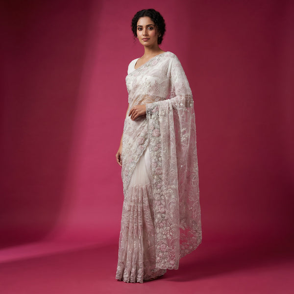 Ivory net saree with tonal thread floral embroidery and scalloped border