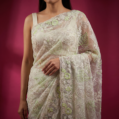 Ivory net saree with pale green thread embroidery on sheer pallu, leaf and vine details