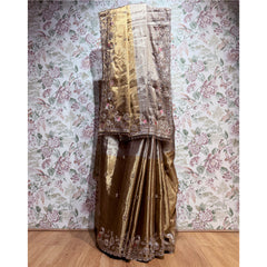 Antique gold viscose-silk saree with ornate cut dana and thread work border, draped