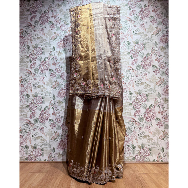 Antique gold viscose-silk saree with ornate cut dana and thread work border, draped