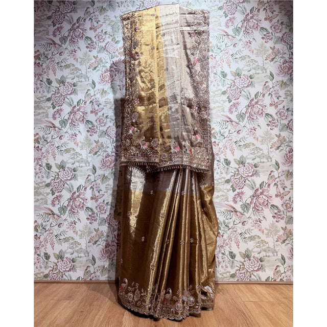 Antique gold viscose-silk saree with ornate cut dana and thread work border, draped
