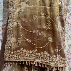 Gold-beige saree with cut-dana beadwork and tassel-edged border