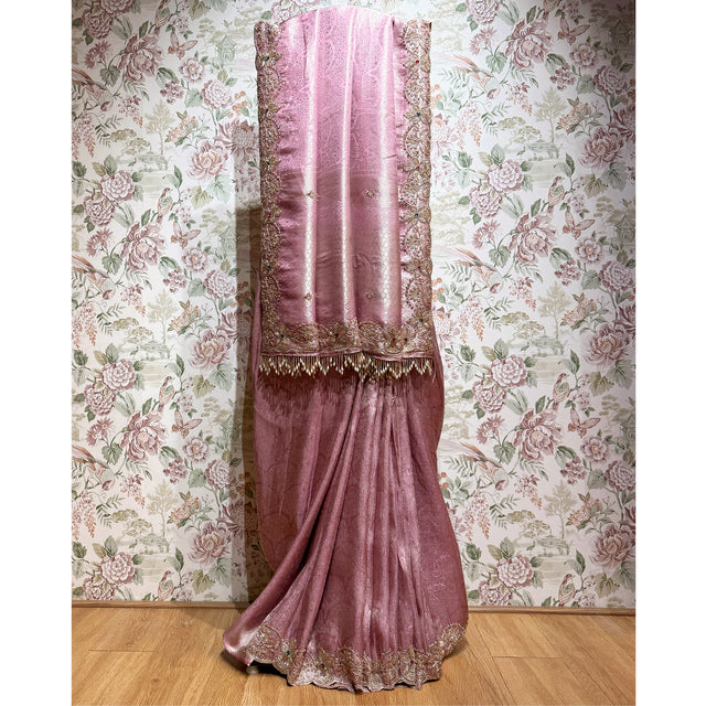 Ombre pink and mauve saree with ornate gold-toned border and small embellishments
