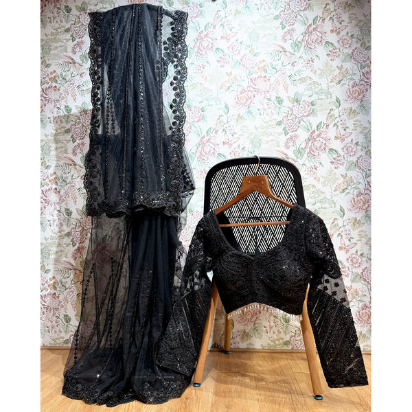 Black net saree with sequined detailing and matching stitched blouse, sheer dark drape