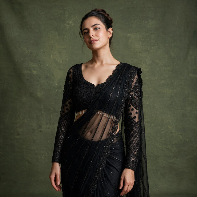 Black beaded net saree with sheer long sleeves blouse, V-neck bodice details