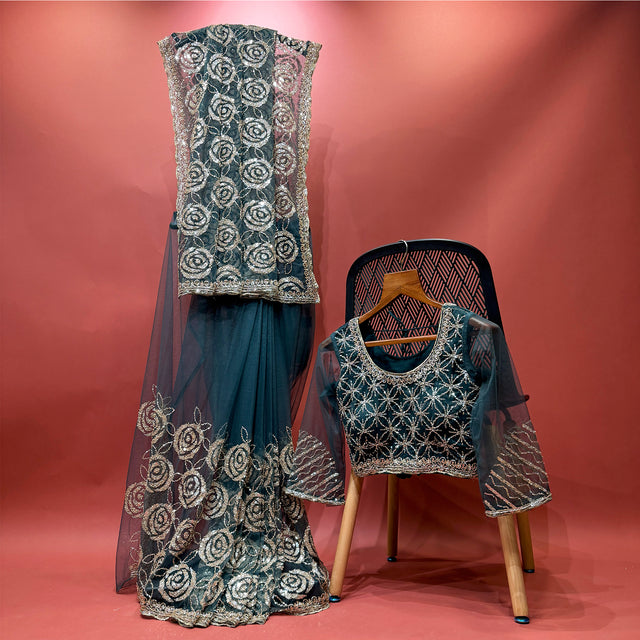 Teal net saree with rose cut-dana embroidery and matching stitched blouse