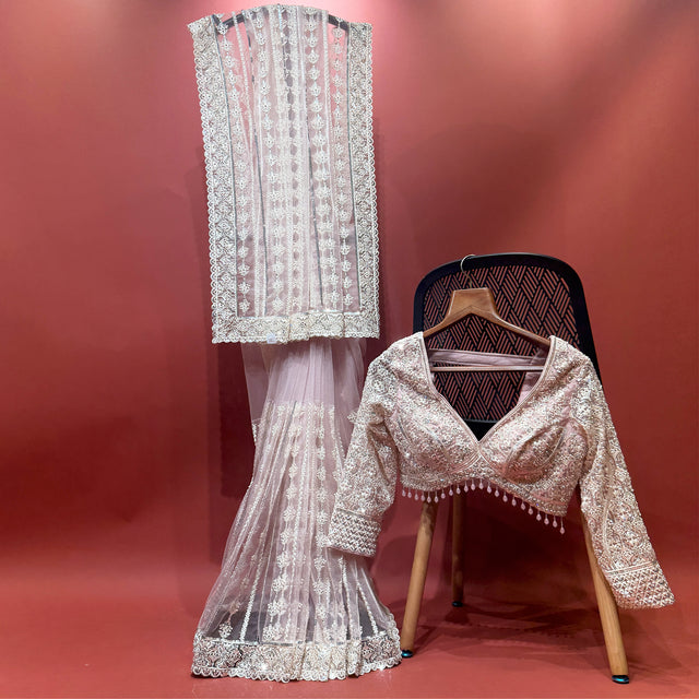 Blush pink net saree with silver sequin and moti trim, long-sleeve stitched blouse