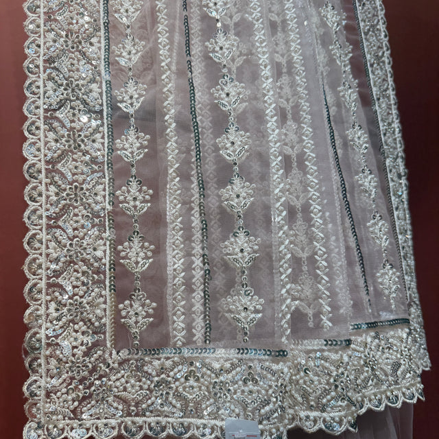 Blush pink net saree with silver moti and sequin vertical motifs and scalloped border