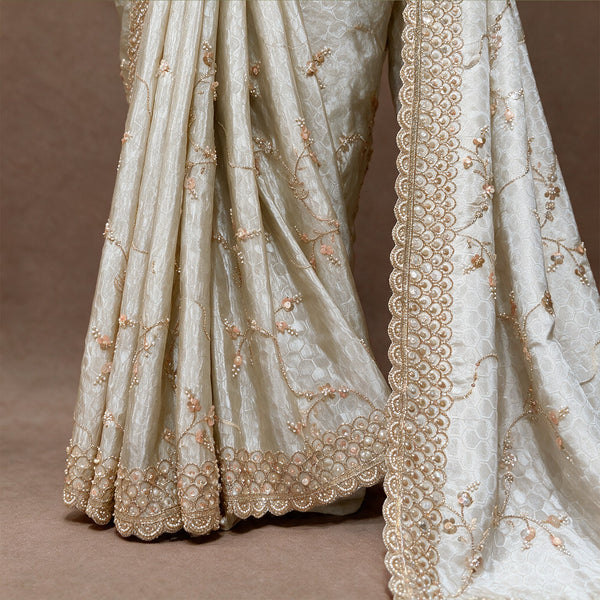 Close-up of honeycomb weave, gold vine handwork and scalloped border on ivory crepe silk