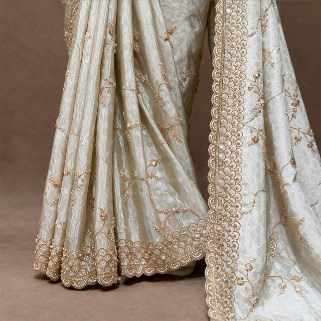 Close-up of honeycomb weave, gold vine handwork and scalloped border on ivory crepe silk