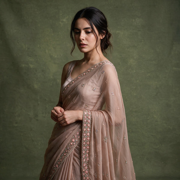 Dusty rose chiffon saree with cutdana beadwork trim and scattered motif work on pallu