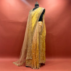 Yellow ombre organza saree with handwork border and jaal work on mannequin
