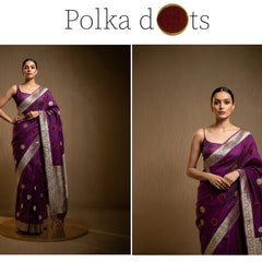 Purple saree with velvet-like polka dots, silver border, and graceful draped pallu