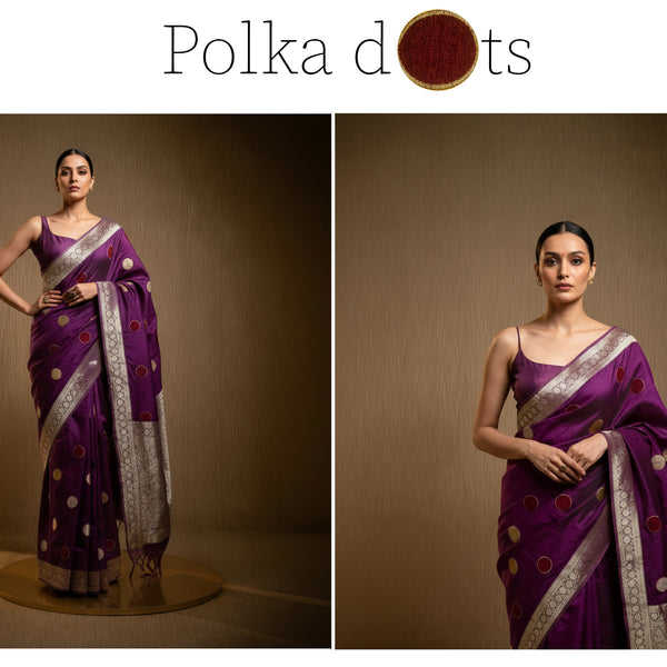 Purple saree with velvet-like polka dots, silver border, and graceful draped pallu