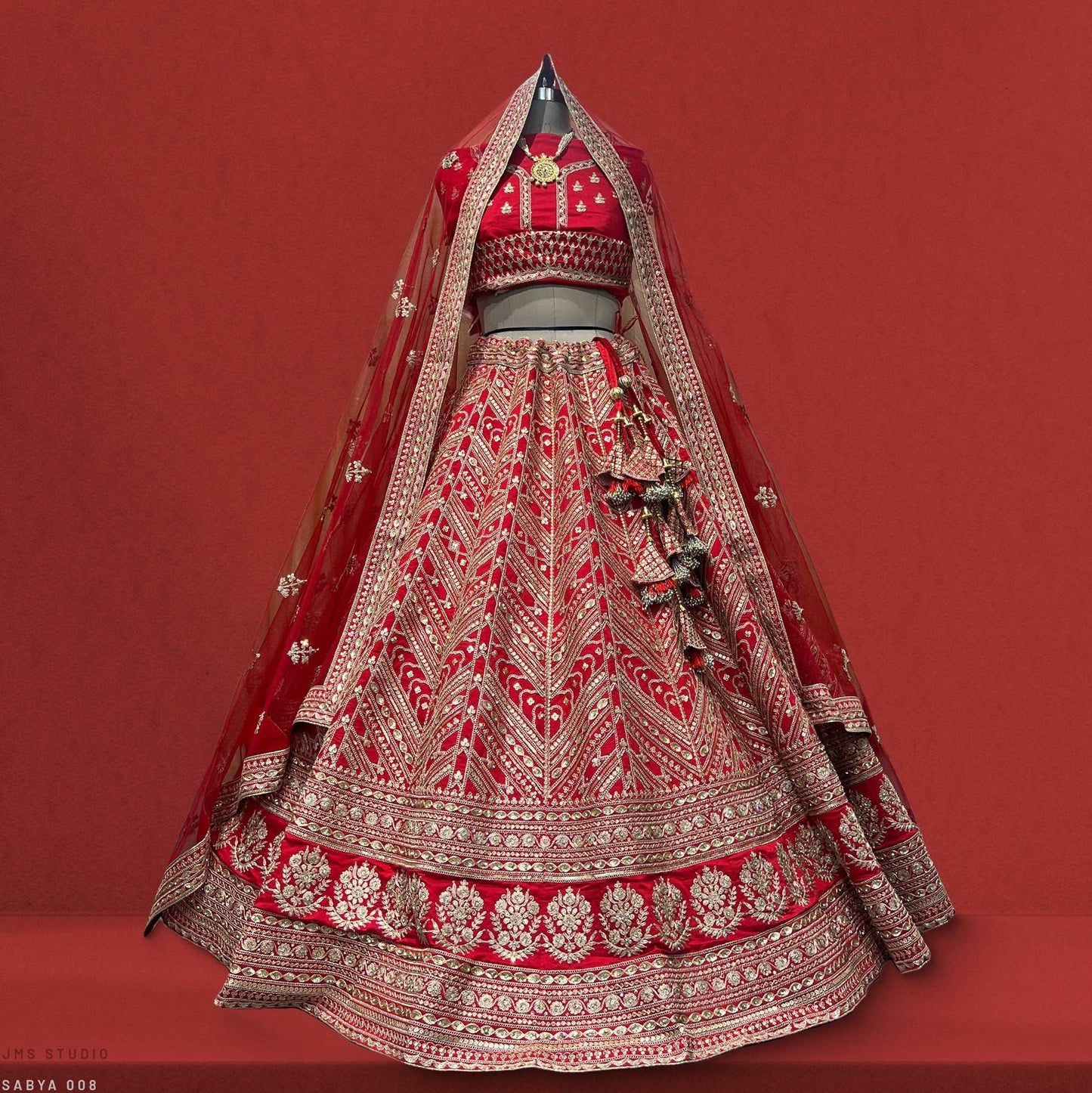 Dulhan in Red Lehenga Elegance: Sabyasachi-Inspired Royal Baggi Collection JMS Studio {{ Royal Red Bridal Lehenga}}