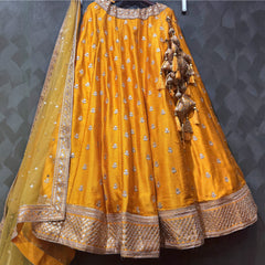 Royal Baggi Collection: Butter Yellow Raw Silk Booti Work Designer Lehenga