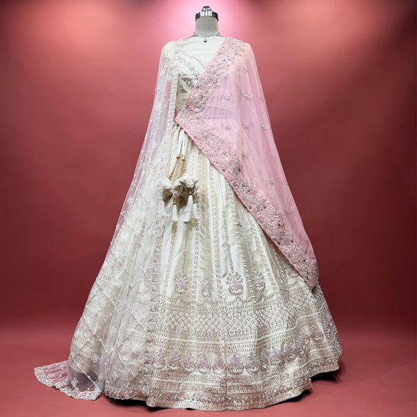 Ivory bridal lehenga with circular skirt and pink embellished double dupatta
