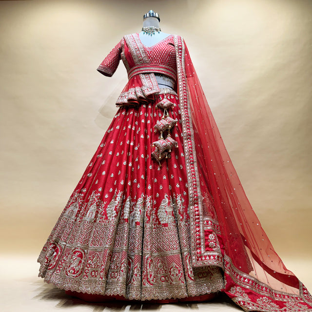 Royal red bridal lehenga with silver jaali and temple motif border, full flare skirt