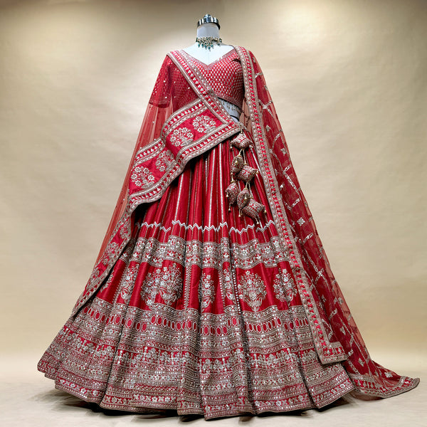 Royal red bridal lehenga with tiered floral border and matching embroidered dupatta