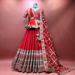 Red bridal lehenga with tiered skirt, gold zari border, and matching dupatta