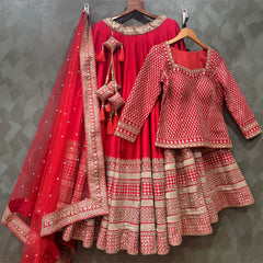 Red lehenga set with embroidered blouse, flared tiered skirt, and draped dupatta