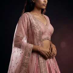 Rose pink lehenga blouse with V-neck, embellished yoke, and sheer embroidered sleeve