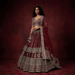 Maroon lehenga with silver embroidered tiers and matching blouse, plus sheer dupatta
