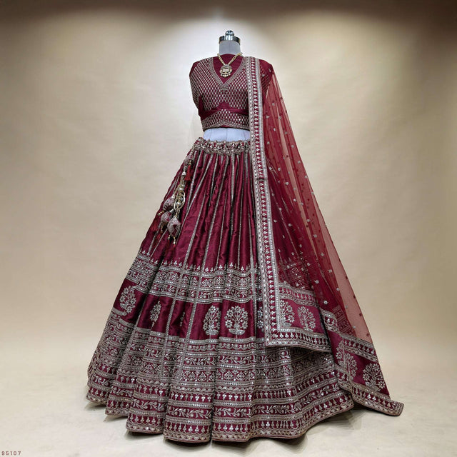 Maroon bridal lehenga set with embroidered blouse, flared tiered skirt and dupatta