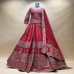 Red raw silk bridal lehenga with long kurti, silver jaal and border embroidery