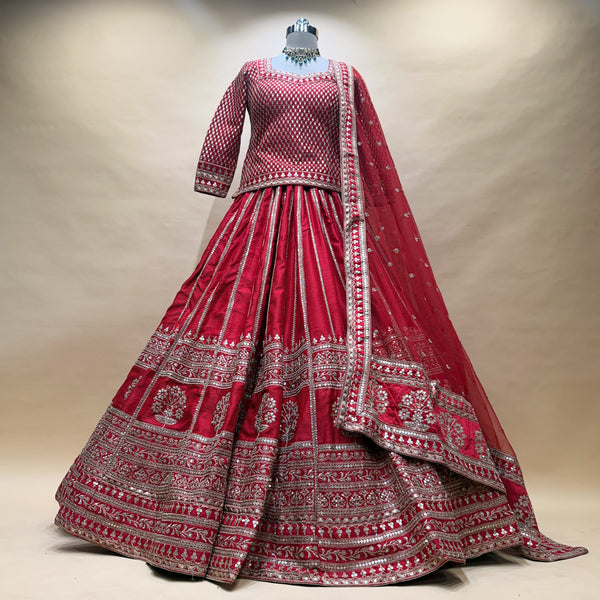 Red raw silk bridal lehenga with long kurti, silver jaal and border embroidery