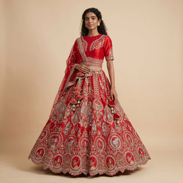Royal red bridal lehenga with ornate gold embroidery and full flared skirt