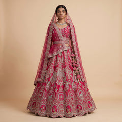Pink raw-silk bridal lehenga with gold embroidery and matching dupatta