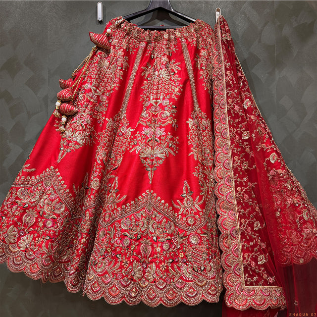 Royal red embroidered lehenga skirt with ornate floral border and scalloped hem